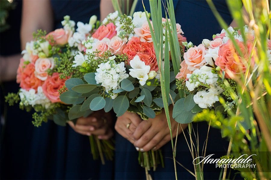 Bridesmaids holding flowers.