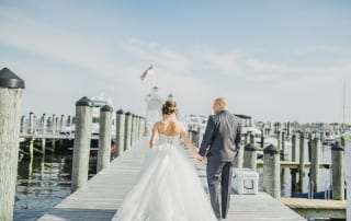Bride and Groom walk on the docks in Old Saybrook, CT.