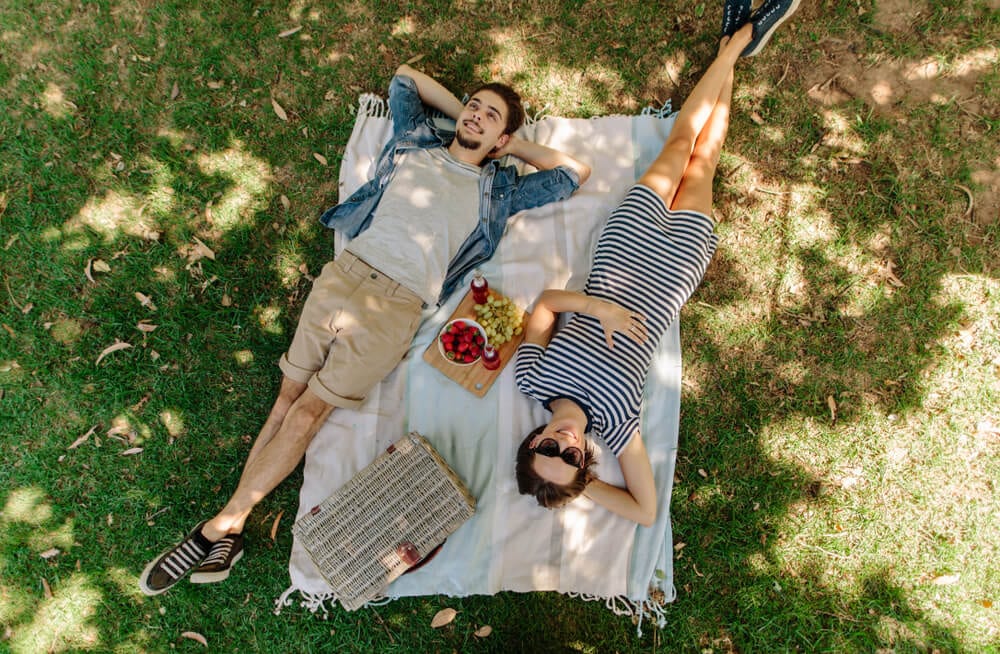 A couple enjoy a nice romantic picnic, one of the many things to do in Old Saybrook, CT while staying at Saybrook Point.