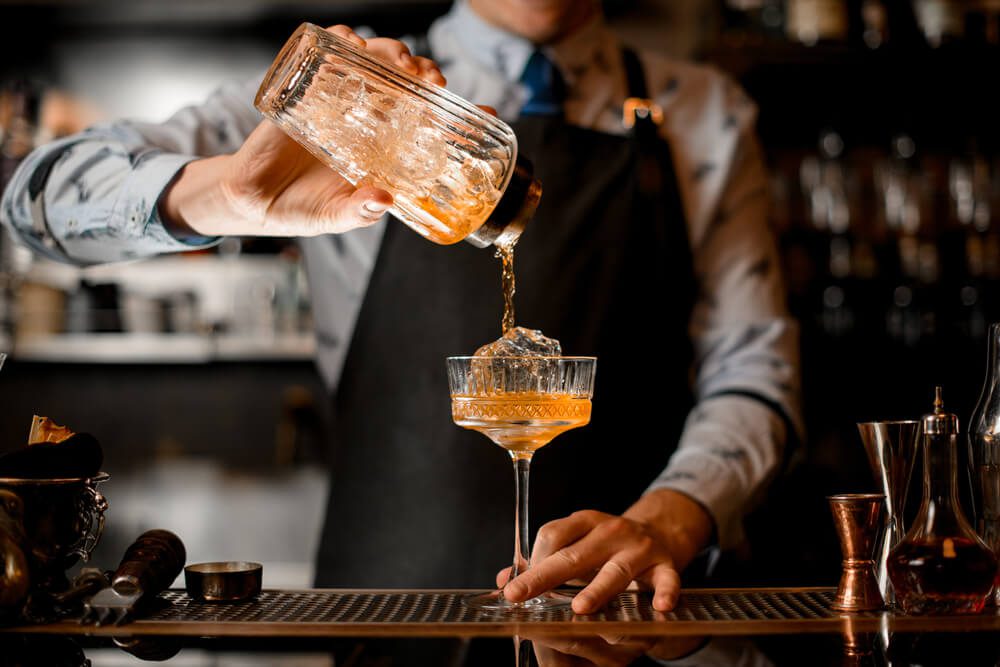 A bartender fixes a old-fashioned cocktail at Old Saybrook's Choo Choo Lounge, a great spot for small food bites and classic drinks.